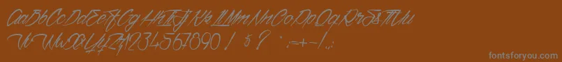 フォントVentillaStone – 茶色の背景に灰色の文字