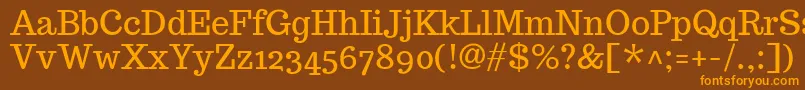 フォントTrocchiRegular – オレンジ色の文字が茶色の背景にあります。