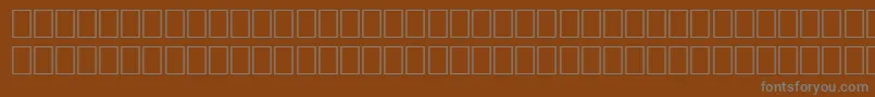 Шрифт WpMultinationalbCourier – серые шрифты на коричневом фоне