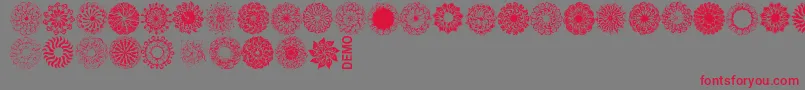 Mandingsdemo-Schriftart – Rote Schriften auf grauem Hintergrund