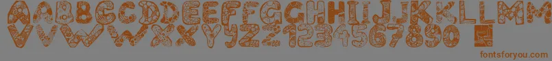 Filledabc-Schriftart – Braune Schriften auf grauem Hintergrund