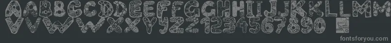 Filledabc-fontti – harmaat kirjasimet mustalla taustalla