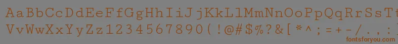 フォントCutivemonoRegular – 茶色の文字が灰色の背景にあります。