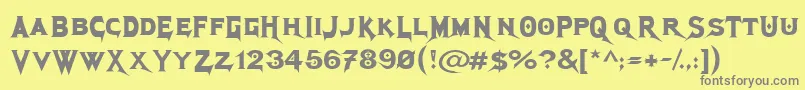 MegadethCryptic-fontti – harmaat kirjasimet keltaisella taustalla