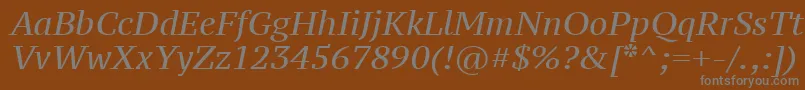 Ptz56f-fontti – harmaat kirjasimet ruskealla taustalla