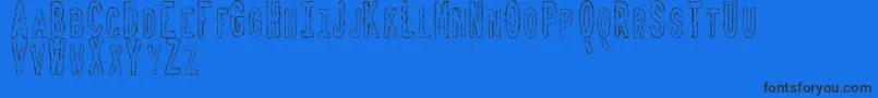 ToxicWasteTfb-Schriftart – Schwarze Schriften auf blauem Hintergrund