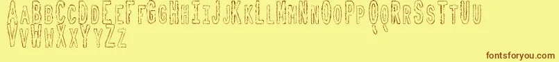 ToxicWasteTfb Font – Brown Fonts on Yellow Background