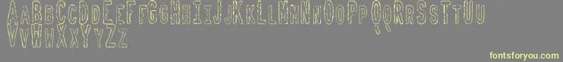 ToxicWasteTfb Font – Yellow Fonts on Gray Background