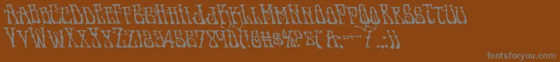Instantzenleft-fontti – harmaat kirjasimet ruskealla taustalla