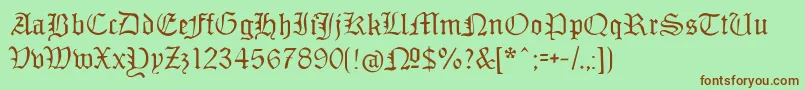 フォントMonamourfrakturregular – 緑の背景に茶色のフォント