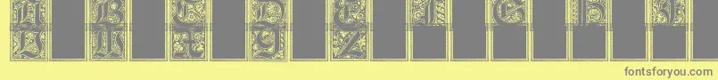 フォントCamelot – 黄色の背景に灰色の文字