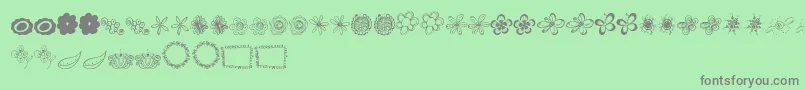 Fonte MtfFlowerDoodles – fontes cinzas em um fundo verde