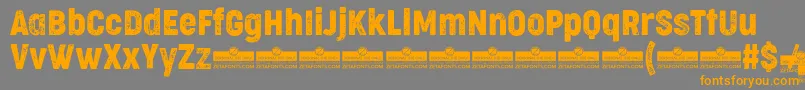 CocogooseCondensedLetterpressTrial-Schriftart – Orangefarbene Schriften auf grauem Hintergrund