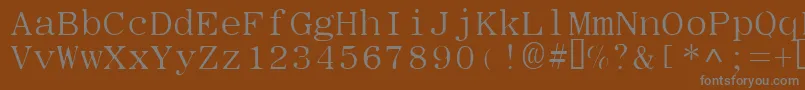 Typew-fontti – harmaat kirjasimet ruskealla taustalla