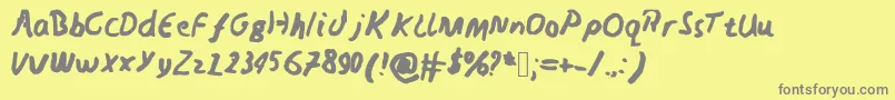 Fonte Nedswriting – fontes cinzas em um fundo amarelo
