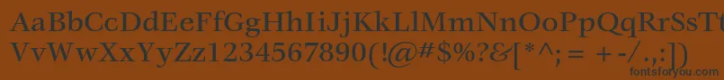 VeljovicstdMedium-fontti – mustat fontit ruskealla taustalla