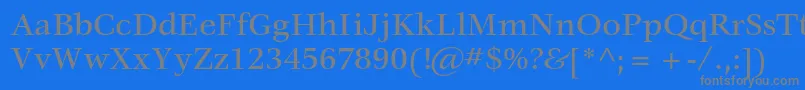 VeljovicstdMedium-Schriftart – Graue Schriften auf blauem Hintergrund