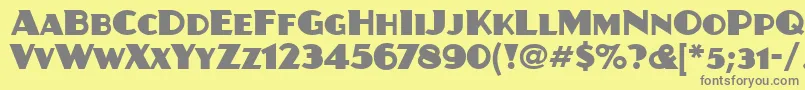 JuanitaitcTt-Schriftart – Graue Schriften auf gelbem Hintergrund