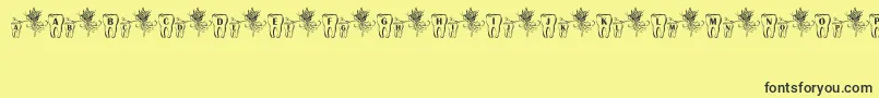 ToothFairy Font – Black Fonts on Yellow Background