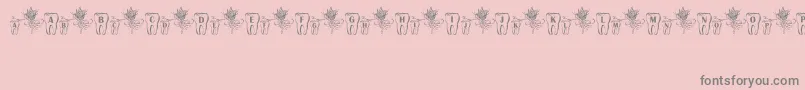 Czcionka ToothFairy – szare czcionki na różowym tle