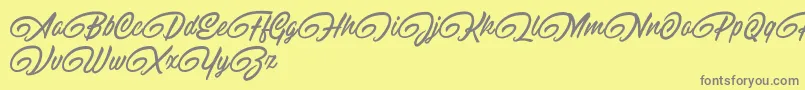 RaitonsDemo-fontti – harmaat kirjasimet keltaisella taustalla