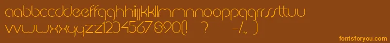 フォントJkabodeLightdemo – オレンジ色の文字が茶色の背景にあります。