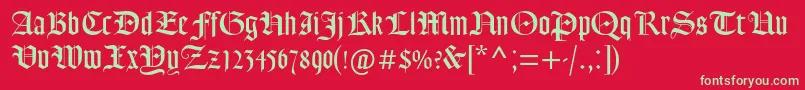 Fonte Goudytextmtstd – fontes verdes em um fundo vermelho