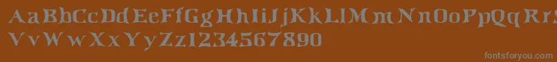 フォントIrishjig – 茶色の背景に灰色の文字