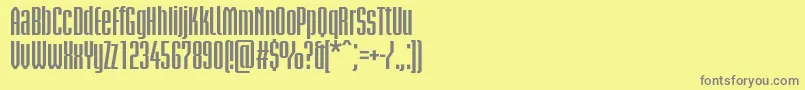 フォントBriemakademistdBoldcond – 黄色の背景に灰色の文字