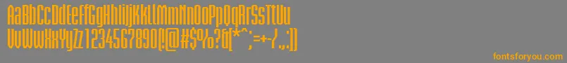 フォントBriemakademistdBoldcond – オレンジの文字は灰色の背景にあります。