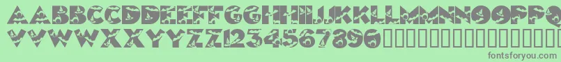 Halloweenkiddyfont-Schriftart – Graue Schriften auf grünem Hintergrund