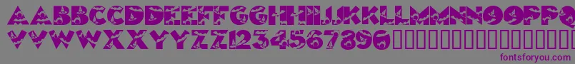 Halloweenkiddyfont-Schriftart – Violette Schriften auf grauem Hintergrund