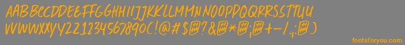 フォントDkDoubleQuick – オレンジの文字は灰色の背景にあります。