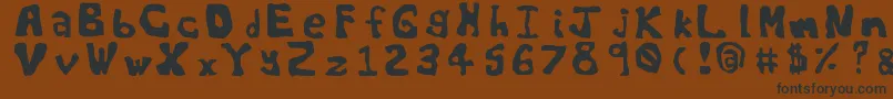 Worldsworstfont-Schriftart – Schwarze Schriften auf braunem Hintergrund