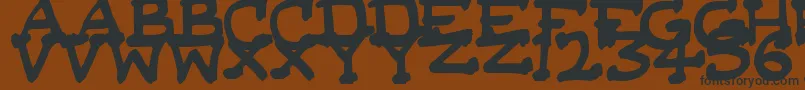 DaSerifKid Font – Black Fonts on Brown Background