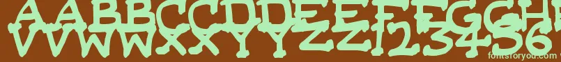 フォントDaSerifKid – 緑色の文字が茶色の背景にあります。