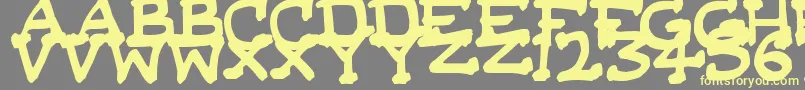 フォントDaSerifKid – 黄色のフォント、灰色の背景