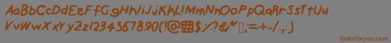 フォントScribz – 茶色の文字が灰色の背景にあります。