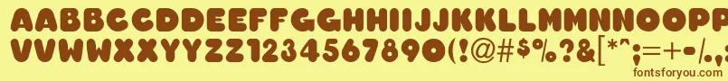 OledascapssskBold-Schriftart – Braune Schriften auf gelbem Hintergrund