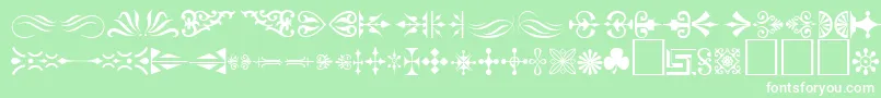 Ornament ffy-fontti – valkoiset fontit vihreällä taustalla