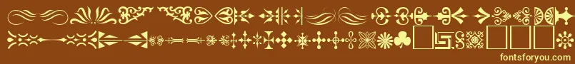 Ornament ffy-fontti – keltaiset fontit ruskealla taustalla