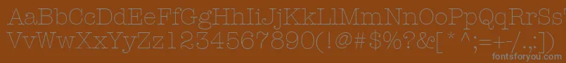 KeyboardLightSsiLight-fontti – harmaat kirjasimet ruskealla taustalla