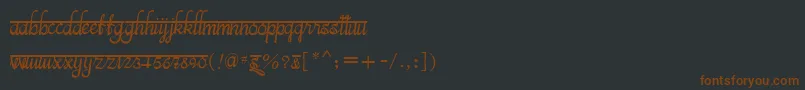 Czcionka BitsindiancalligraRegular – brązowe czcionki na czarnym tle
