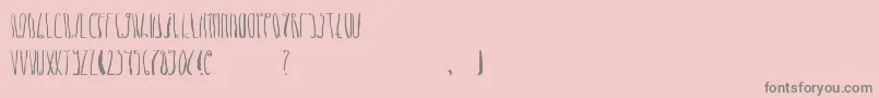 DheLongZim-fontti – harmaat kirjasimet vaaleanpunaisella taustalla