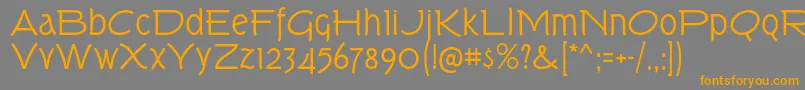 フォントTorkRg – オレンジの文字は灰色の背景にあります。