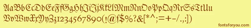 フォントDsluthersche – 茶色の文字が黄色の背景にあります。
