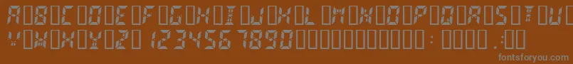 Fonte Digital2 – fontes cinzas em um fundo marrom