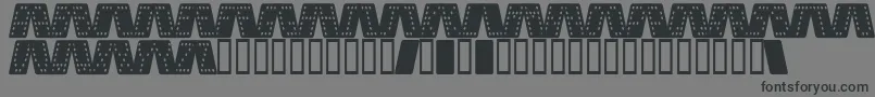 Шрифт DominoSmalKursiv – чёрные шрифты на сером фоне