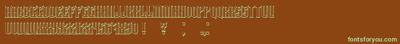 フォントDamages3D – 緑色の文字が茶色の背景にあります。