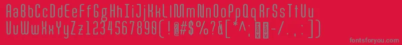 フォントQuotaRegularcond. – 赤い背景に灰色の文字